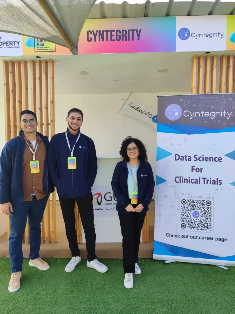 Cyntegrity team members at a recruitment booth promoting data science careers in clinical trials.